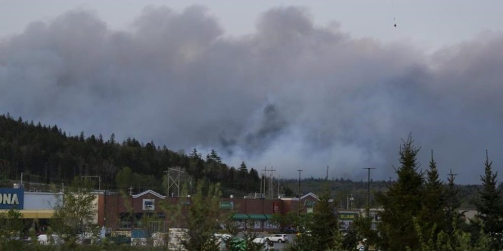 Thousands flee wildfires near Halifax