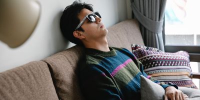 Man sleeping on couch via pexels