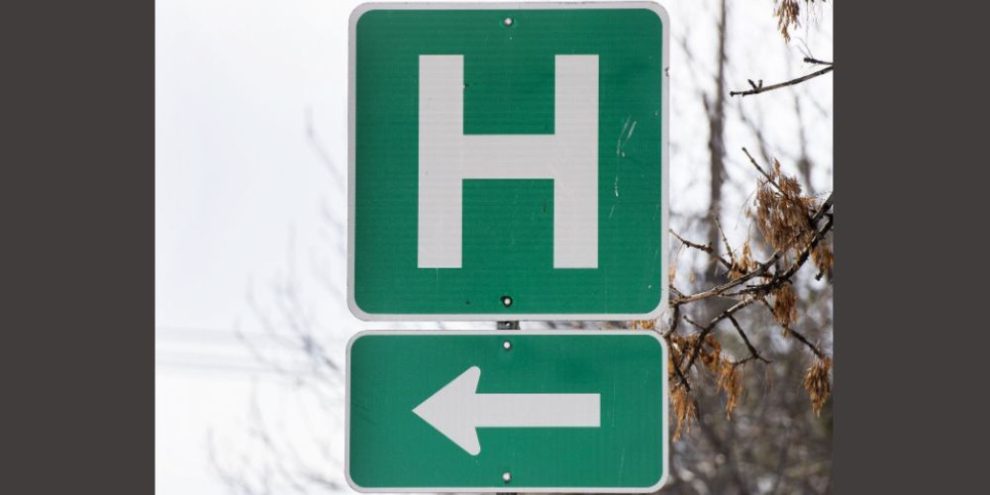 Ontario doctors blast province for ending health care for uninsured residents - (Hospital sign) - CP