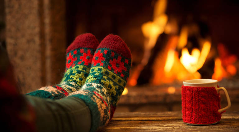 fire cozy socks mug warm fireplace