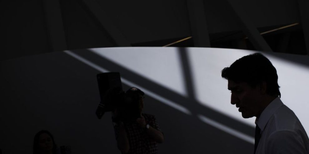 Prime Minister Justin Trudeau is silhouetted as he speaks to the press during an announcement at Women’s College Hospital, in Toronto, Thursday, March 7, 2024.