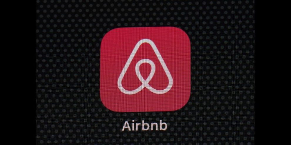 FILE - The Airbnb app icon is displayed on an iPad screen in Washington, D.C., on May 8, 2021. Airbnb says it’s banning the use of indoor security cameras in listings around the world by the end of next month. The San Francisco-based online rental platform said it making the change to simplify its security camera policy and continue efforts to prioritize privacy. (AP Photo/Patrick Semansky, File)