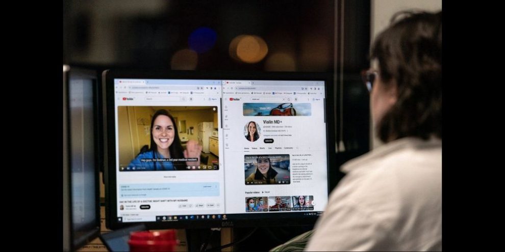 Woman looking at computer monitor