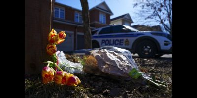 Flowers sit at the scene of a homicide where six people were found dead in the Barrhaven suburb of Ottawa on Thursday, March 7, 2024. THE CANADIAN PRESS/Sean Kilpatrick