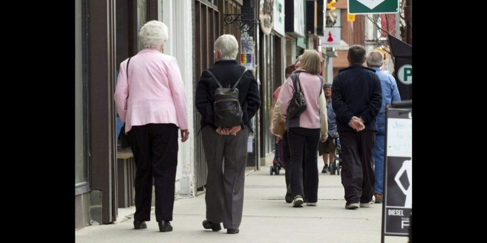 A new Statistics Canada report says half a million seniors had trouble getting specialized care they needed. Seniors walk down a street in Peterborough, Ont. on May 7, 2012. THE CANADIAN PRESS/Frank Gunn