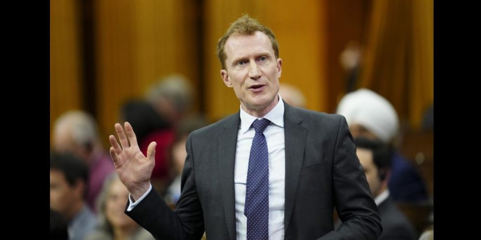 Immigration, Refugees and Citizenship Minister Marc Miller rises during question period in the House of Commons on Parliament Hill in Ottawa on Monday, March 18, 2024. Miller says the amended Israel Hamas motion passed by the House of Commons Monday could make it harder for Canada to help get people out of Gaza. THE CANADIAN PRESS/Sean Kilpatrick