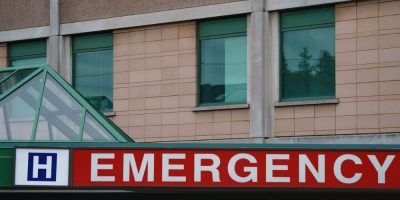 Seven people in Ontario have been fined for refusing transfers from a hospital to a long-term care home not of their choosing. The emergency sign of a Toronto hospital is photographed on Tuesday, Sept. 27, 2022. THE CANADIAN PRESS/Alex Lupul