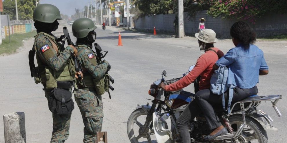 Soldiers patrol the road near the international airport in Port-au-Prince, Haiti, Wednesday, March 13, 2024.