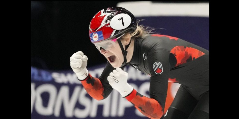 Canada's Kim Boutin celebrates winning the gold medal in the women's 500 meters final during the World Championships Short Track skating at Ahoy Arena in Rotterdam, Netherlands, Saturday, March 16, 2024.THE CANADIAN PRESS/AP/Peter Dejong