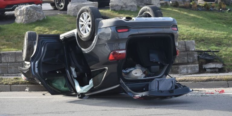 (UPDATE) Passenger apprehended, driver sought after rollover on ...