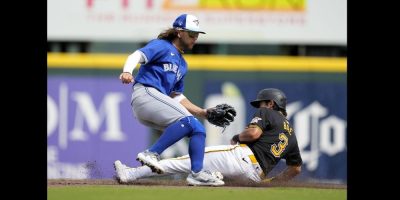 Pittsburgh Pirates' Ji Hwan Bae steals second base as Toronto Blue Jays shortstop Bo Bichette, left, waits for the throw in the third inning of a spring training baseball game Tuesday, March 5, 2024, in Bradenton, Fla. THE CANADIAN PRESS/AP, Charlie Neibergall