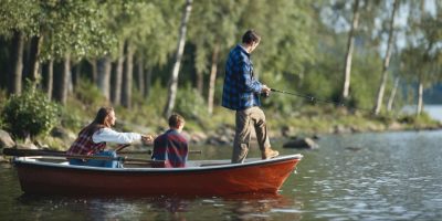 Family fishing near campsite