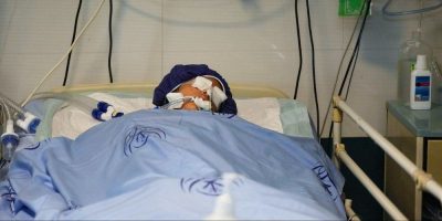 Girl unconscious in hospital bed in Tehran - AP