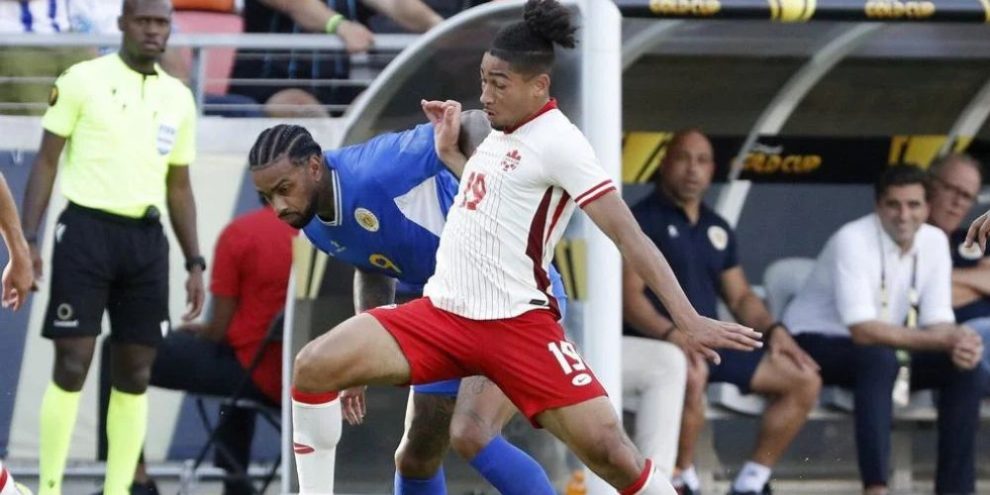 Canada's Nathan Saliba (19) pushes off Curacao's Jürgen Locadia, left, as he moves the ball during a CONCACAF Gold Cup match Saturday, June 21, 2025