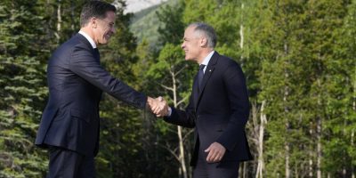 Mark Rutte shaking hands with Mark Carney - CP
