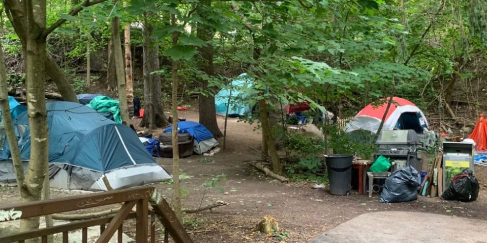 By-law officers at Berczy Park as some encampment residents accept shelter options