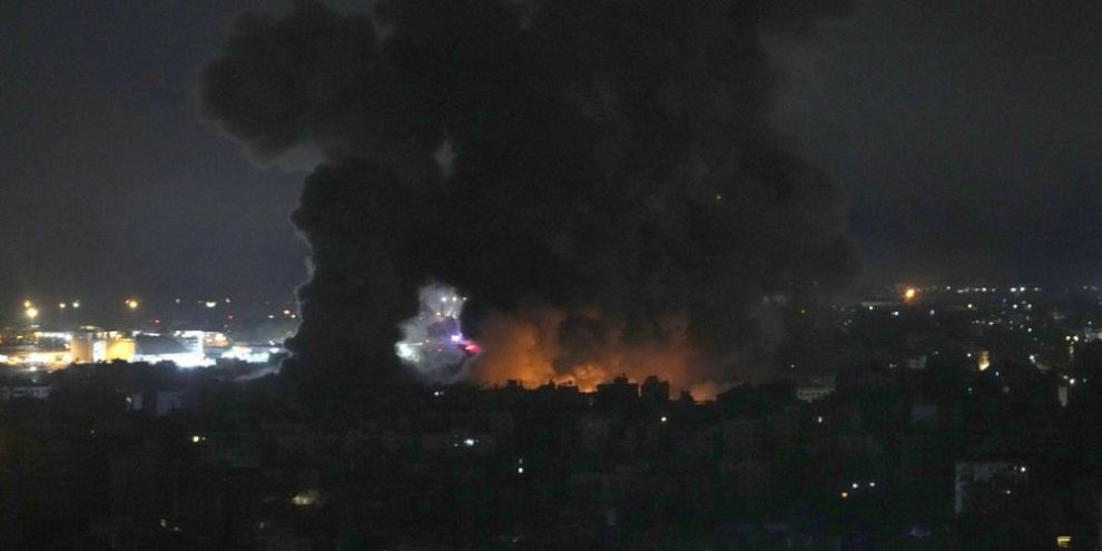 Israeli airstrikes rock southern suburbs of Beirut and cut off a key crossing into Syria