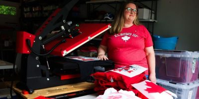 Stephanie Tomlin stands for a portrait in her workspace where she prints Canadian-themed apparel, in Toronto