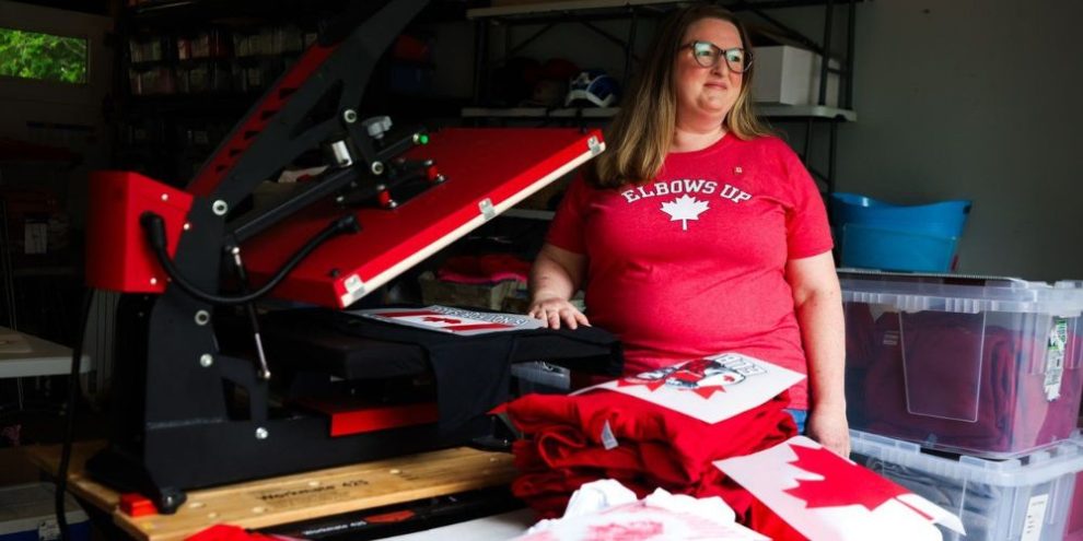 Stephanie Tomlin stands for a portrait in her workspace where she prints Canadian-themed apparel, in Toronto