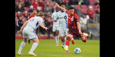 Toronto FC's Theo Corbeanu lines up a strike defended by CF Montreal's Samuel Piette