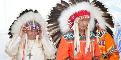Pope Francis in an indigenous headdress.