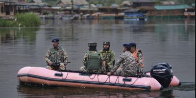 Military crew on a river craft.
