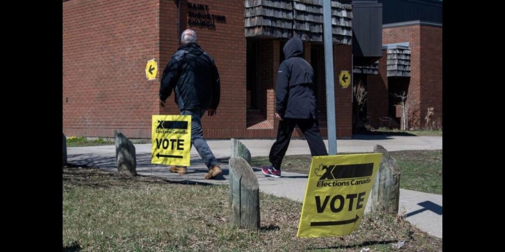 Voters walking into a polling station