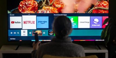 Man in front of smart television