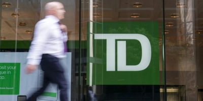Man walks past TD Bank.