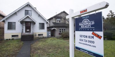 Sold sign in front of house