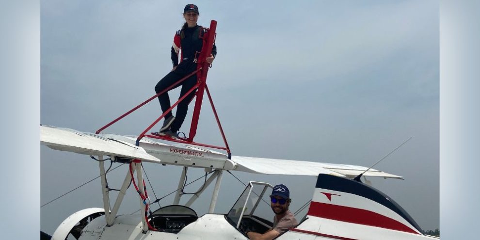 Man and woman on biplane