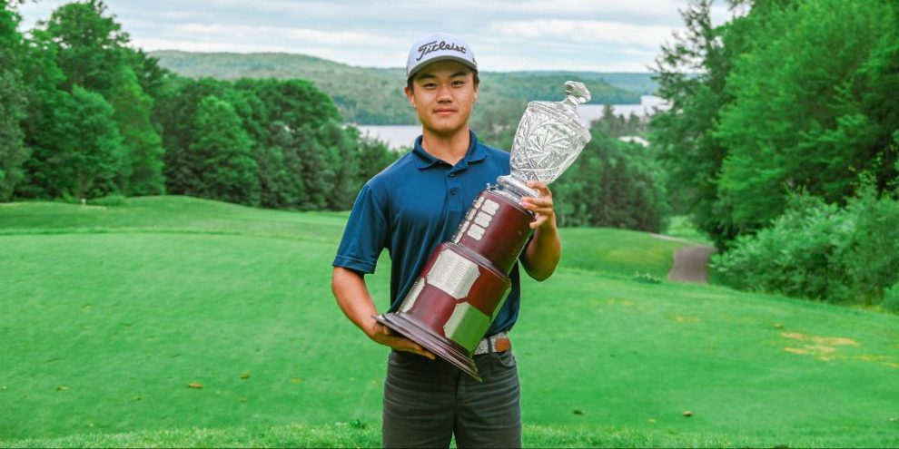 Eric Zhao holds the trophy as Ontario's amateur golf champion