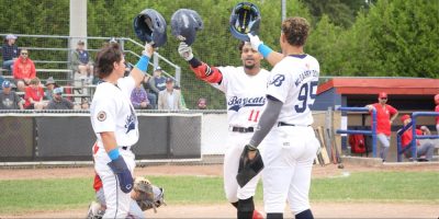 Alex Wickett (left), Brandon Hernandez (centre), and Noel McGarry-Doyle (right) celebrating a home run.