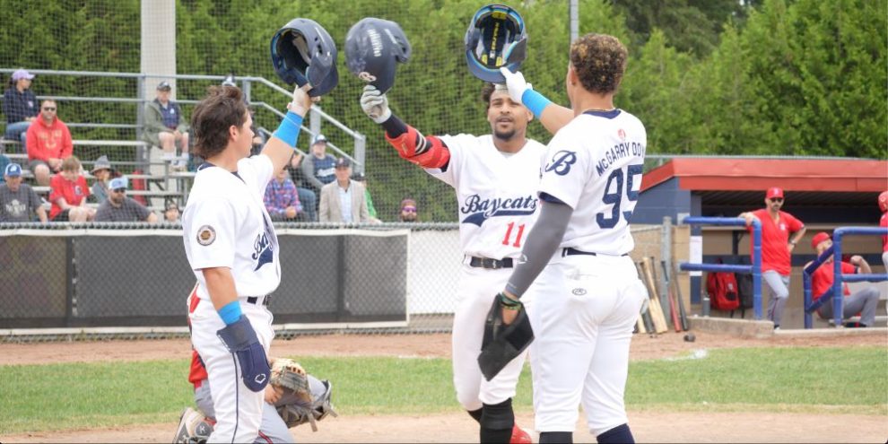 Alex Wickett (left), Brandon Hernandez (centre), and Noel McGarry-Doyle (right) celebrating a home run.