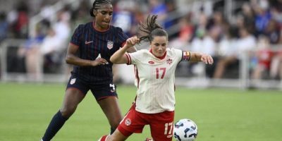 Canada midfielder Jessie Fleming (17) and United States defender Naomi Girma (4) battle for the ball during the first half of an international friendly