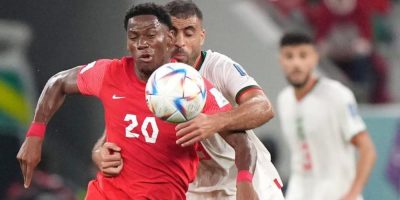 Canada forward Jonathan David (20) plays the ball as Morocco forward Abderrazak Hamdallah (9) defends during second-half group F World Cup soccer action at the Al Thumama Stadium in Doha