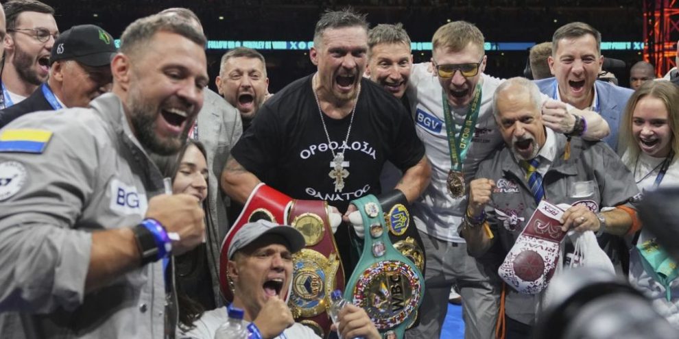 Ukraine’s Oleksandr Usyk celebrates winning the undisputed world heavyweight boxing title fight against Britain’s Daniel Dubois in London