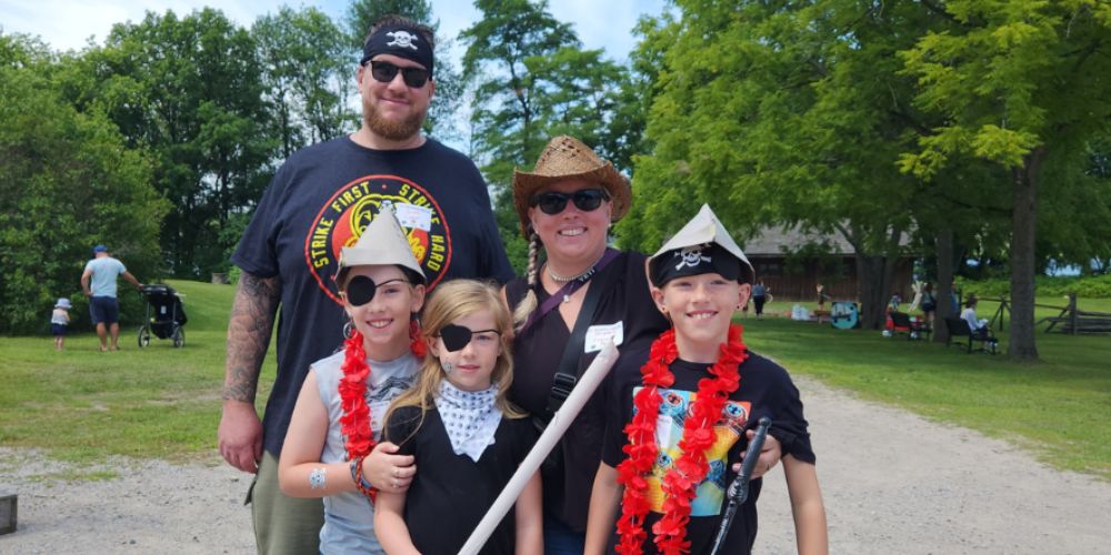 Family dressed up at Pirates of the Bay