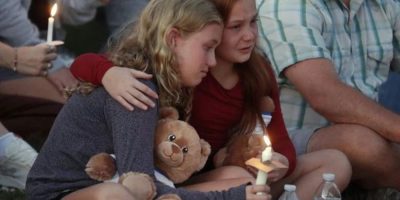 Hundreds honour 2 children killed and 17 people wounded in shooting at a Minneapolis Catholic school