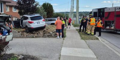 Four people inside this grey Hyundai Tuscon were taken to hospital via ambulance after the vehicle crashed into the front yard of the home.