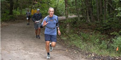 Carney surprises many with appearance at long-distance trail race