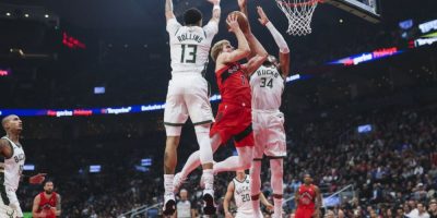 Antetokounmpo scores 31 as Bucks beat Raptors 122-116 to spoil home opener