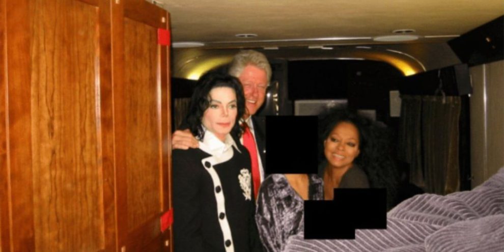 This undated, redacted photo released by the U.S. Department of Justice shows Michael Jackson, former President Bill Clinton and Diana Ross with an unknown person. (U.S. Department of Justice via AP) Uncredited