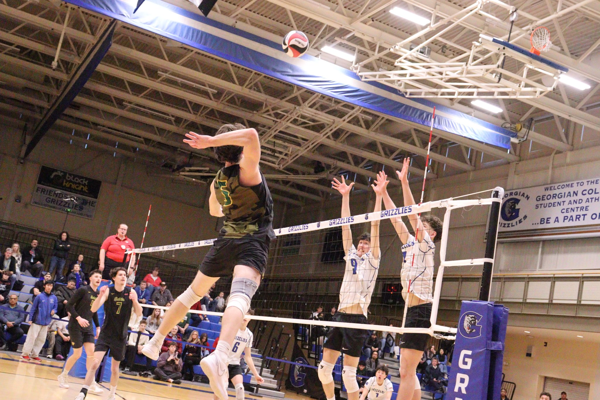 Georgian avoids playoff upset with five-set win in men's volleyball ...