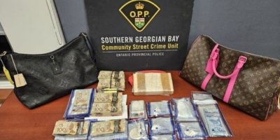 Items seized by police including cocaine, cash, jewellery and designer luggage displayed during a Tay Township drug trafficking investigation