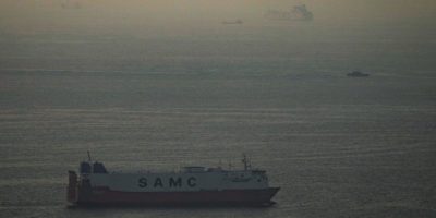 Cargo ships sail in the Persian Gulf toward the Strait of Hormuz in the United Arab Emirates, March 19, 2026.