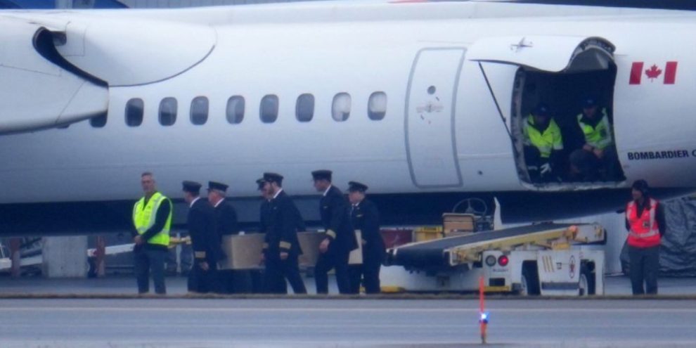 Pilots carry the casket of Jazz Aviation First Officer Mackenzie Gunther during repatriation in Ottawa on March 26, 2026.
