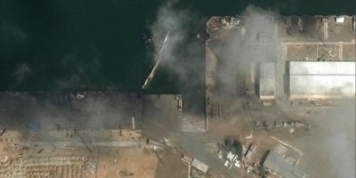 Satellite image of a capsized ship at Koanarak Naval Base in Iran on March 4, 2026, showing damage from the ongoing conflict.