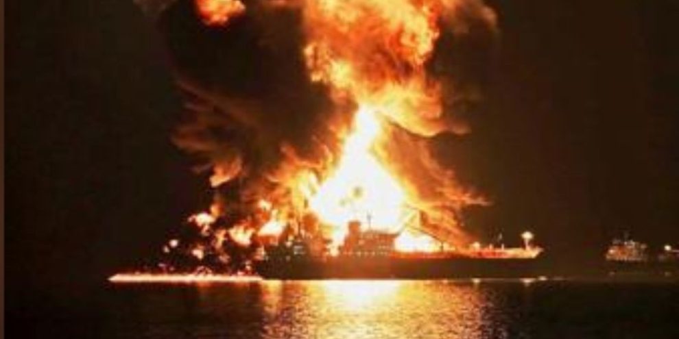 An oil tanker burning after being hit by an Iranian strike at Khor al-Zubair port near Basra, Iraq
