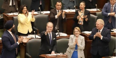 Ontario Finance Minister Peter Bethlenfalvy delivers the 2026 budget as Premier Doug Ford and PC caucus members applaud at Queen’s Park in Toronto.